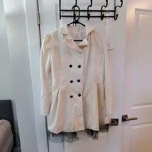 White coat with black lace trim